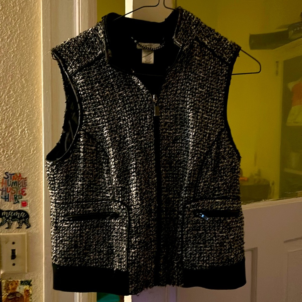 Black color, like-wool with leather trimming vest. By Caché and very warm.